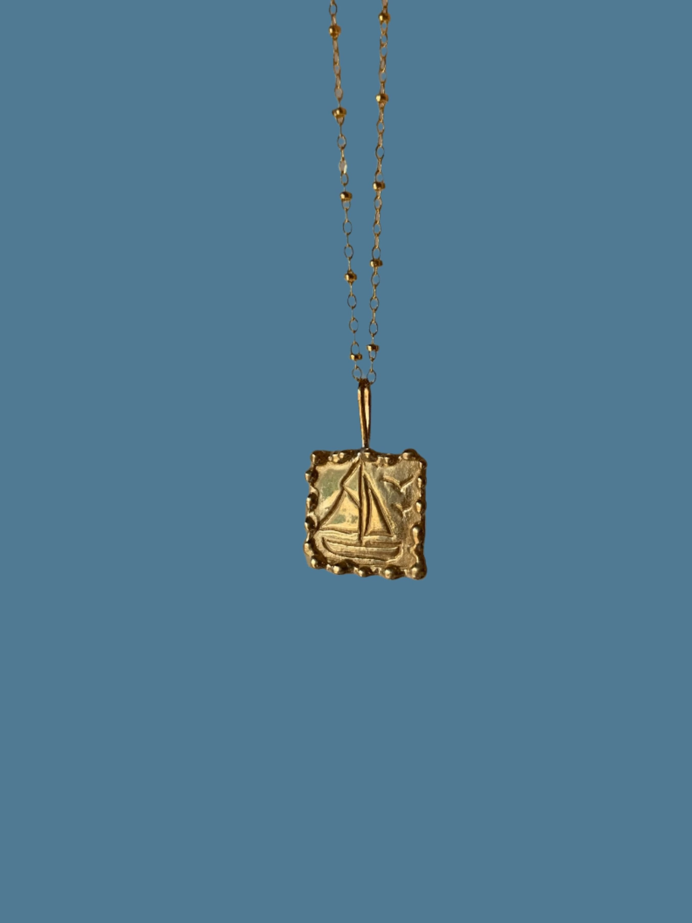 John’s boat necklace