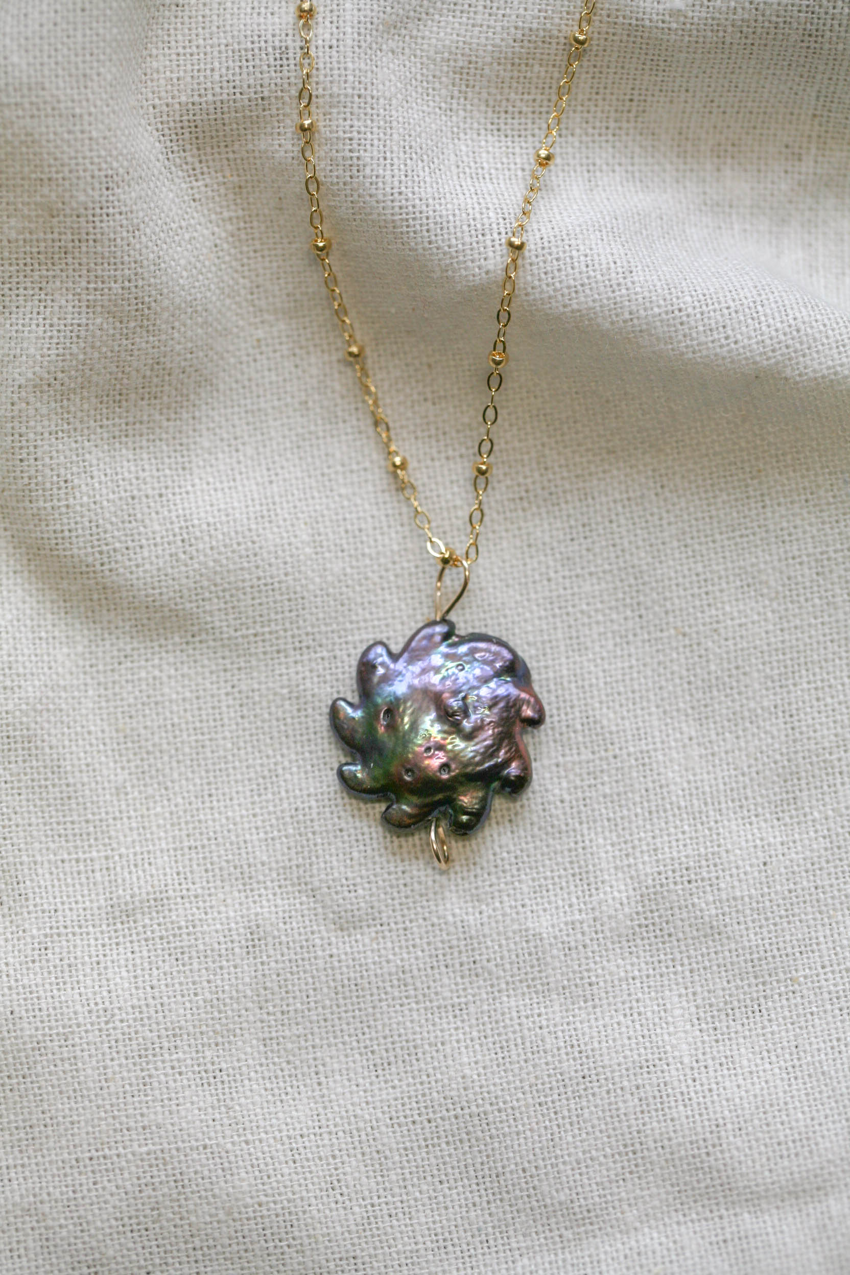 Sun pearl charm