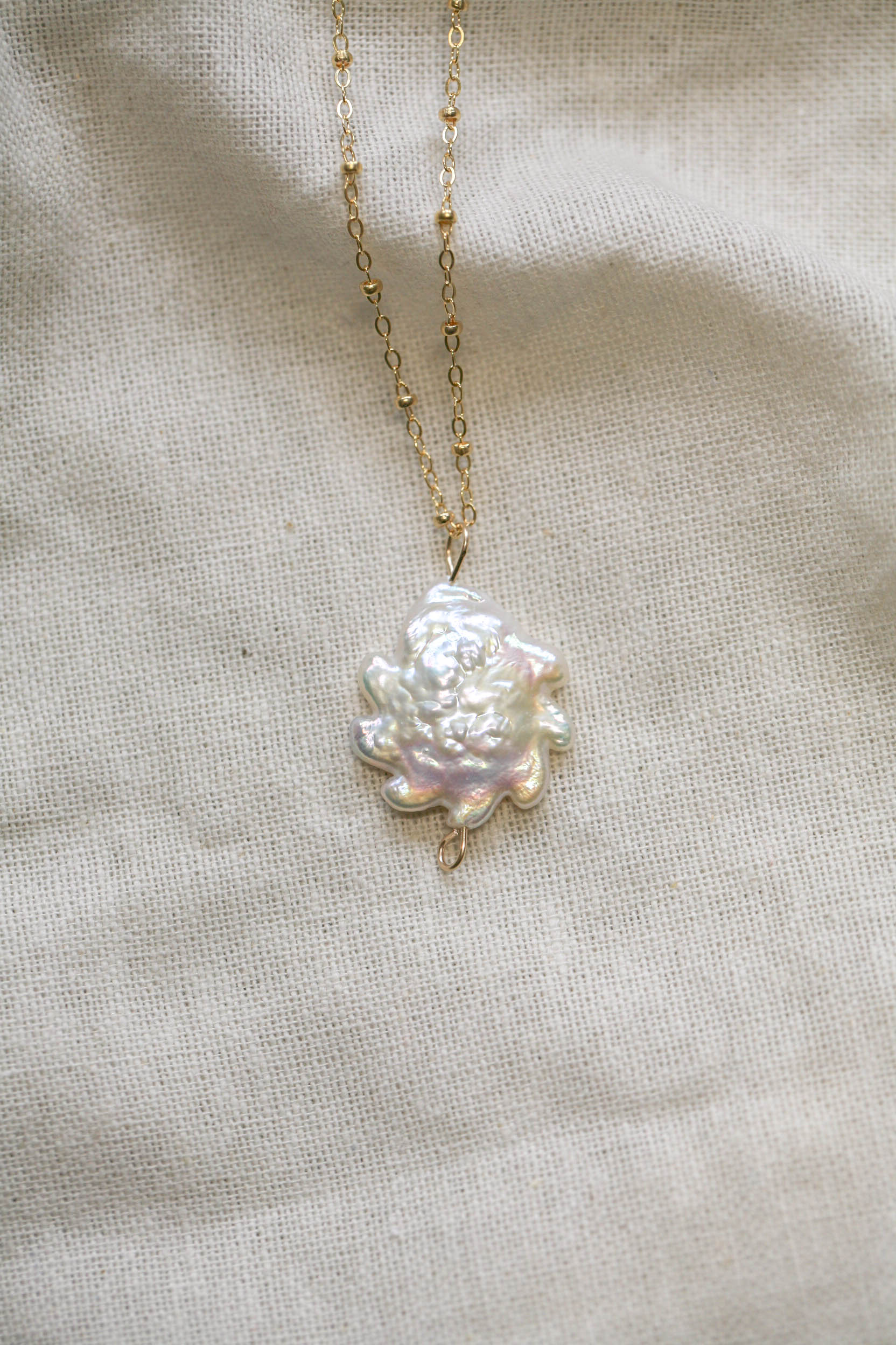 Sun pearl charm